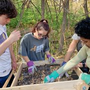 Students sift items from an archaeological dig