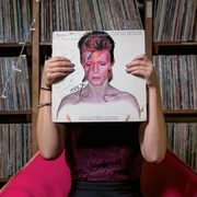 A person holds a record album (David Bowie's 