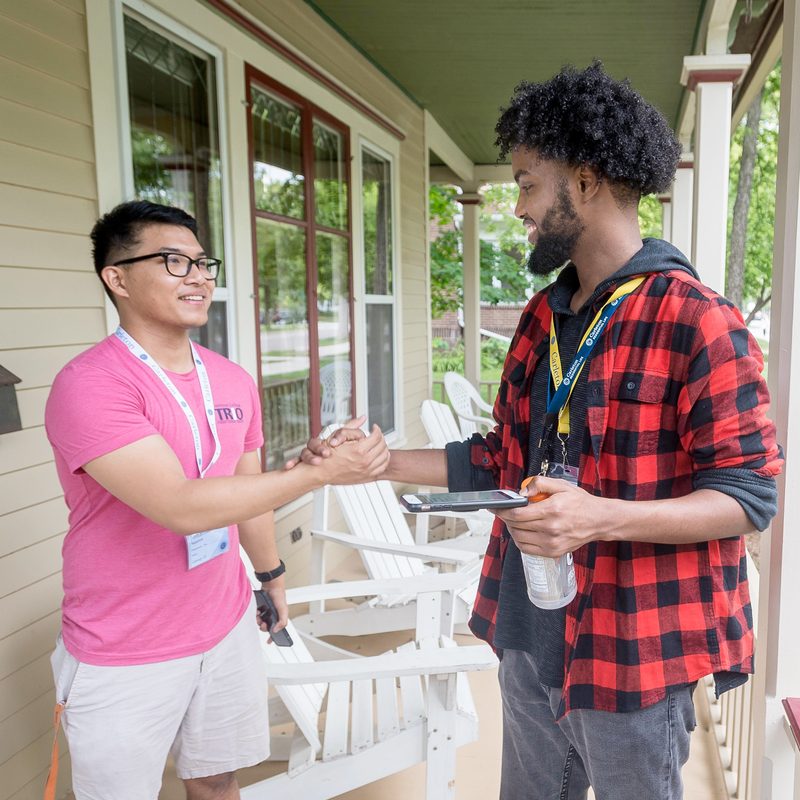 Two students shaking hands