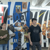 four students standing and presenting their project