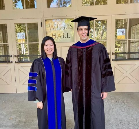 New Economics Professors Yingtong Xie and Victor Almeida attend opening convocation