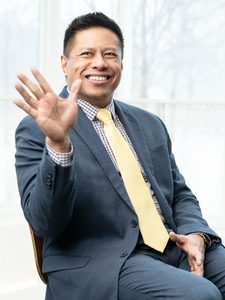 RJ Holmes-Leopold, smiling and waving