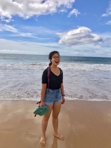 Jennifer Chan stands on a beach